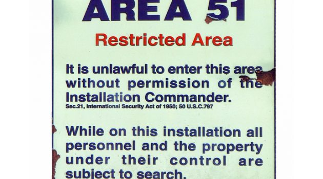 Vintage Area 51 warning sign isolated over white